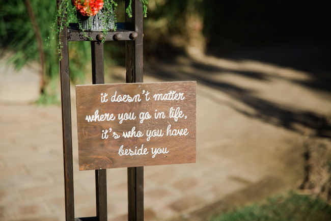 A romantic “We Still Do” sign with candles and floral accents.